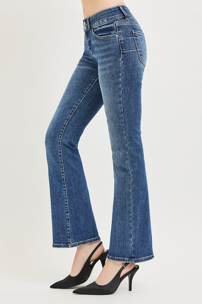 Medium wash low rise bootcut jeans, side view, flared hem and stitched leg seams