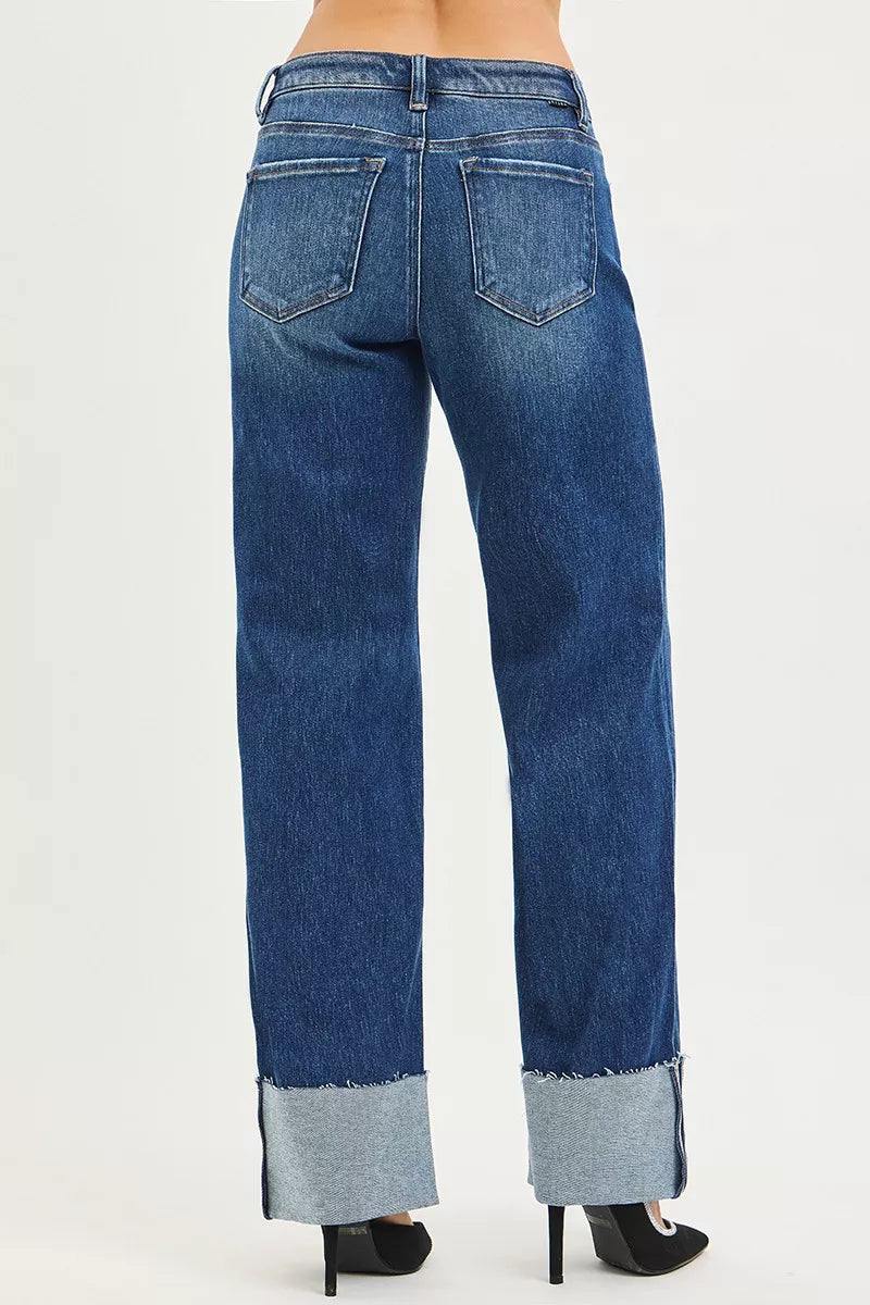 Women’s mid-rise wide-leg jeans in dark blue denim with back pockets and wide cuff