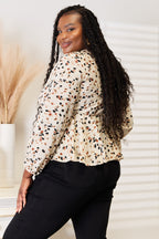 Printed Plunge Peplum Blouse – Bold, Feminine & Eye-Catching Style