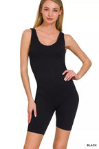 Black seamless sports romper with scoop neck and fitted biker shorts
