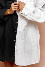 Women's oversized button-up shirt front detail, black placket and ivory body panels