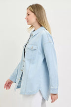 Light blue denim shacket with pointed collar, flap pockets, and long sleeves