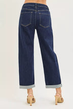 Dark blue cropped jeans with two back pockets and cuffed hems