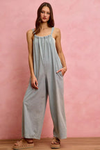 Light blue denim wide-leg overalls with relaxed fit and gathered square neckline
