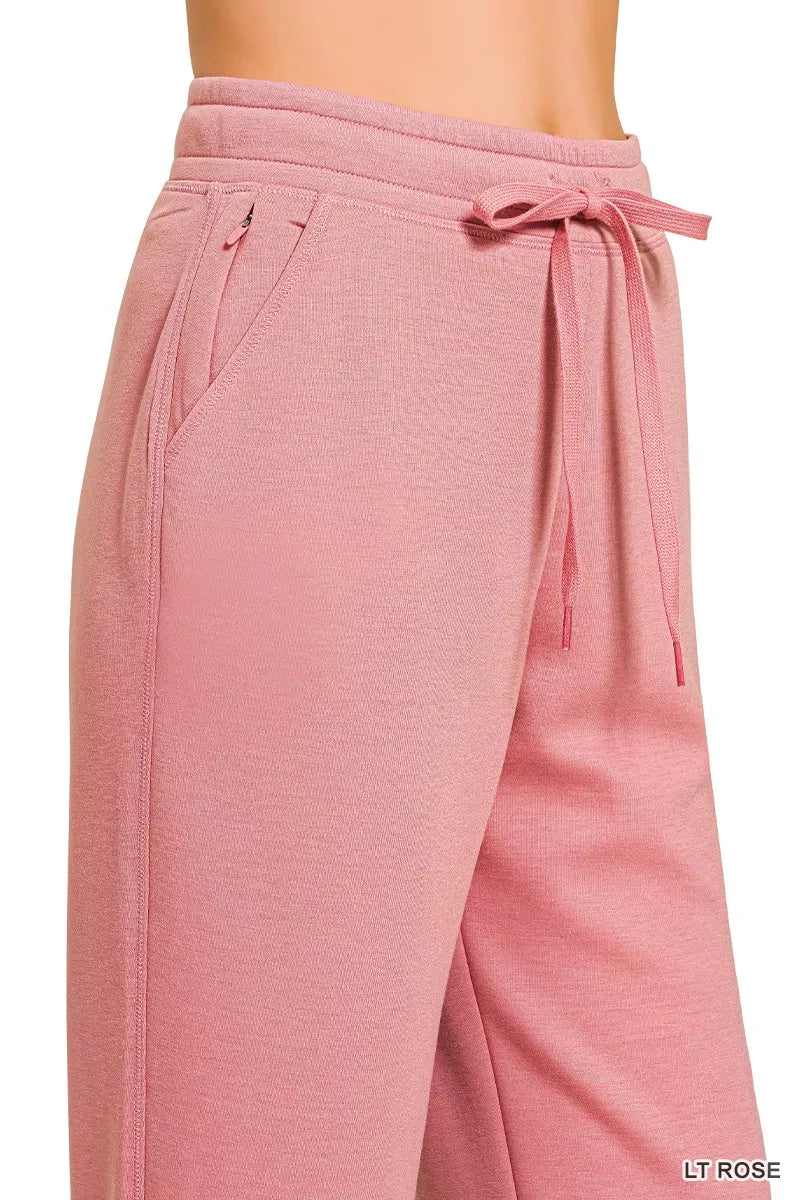 Light rose joggers with drawstring waist and angled back pocket detail