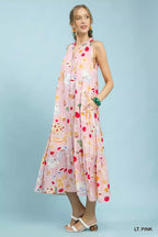Light pink halter tiered midi dress, colorful abstract print with vertical paneling