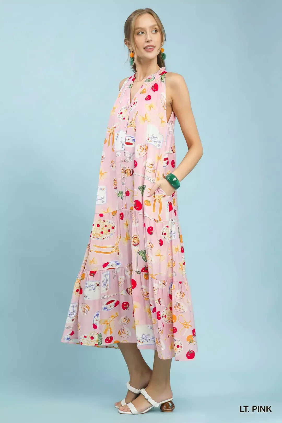 Light pink halter tiered midi dress, colorful abstract print with vertical paneling