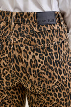 Leopard print denim jeans with 'Judy Blue' waistband label and front pockets.