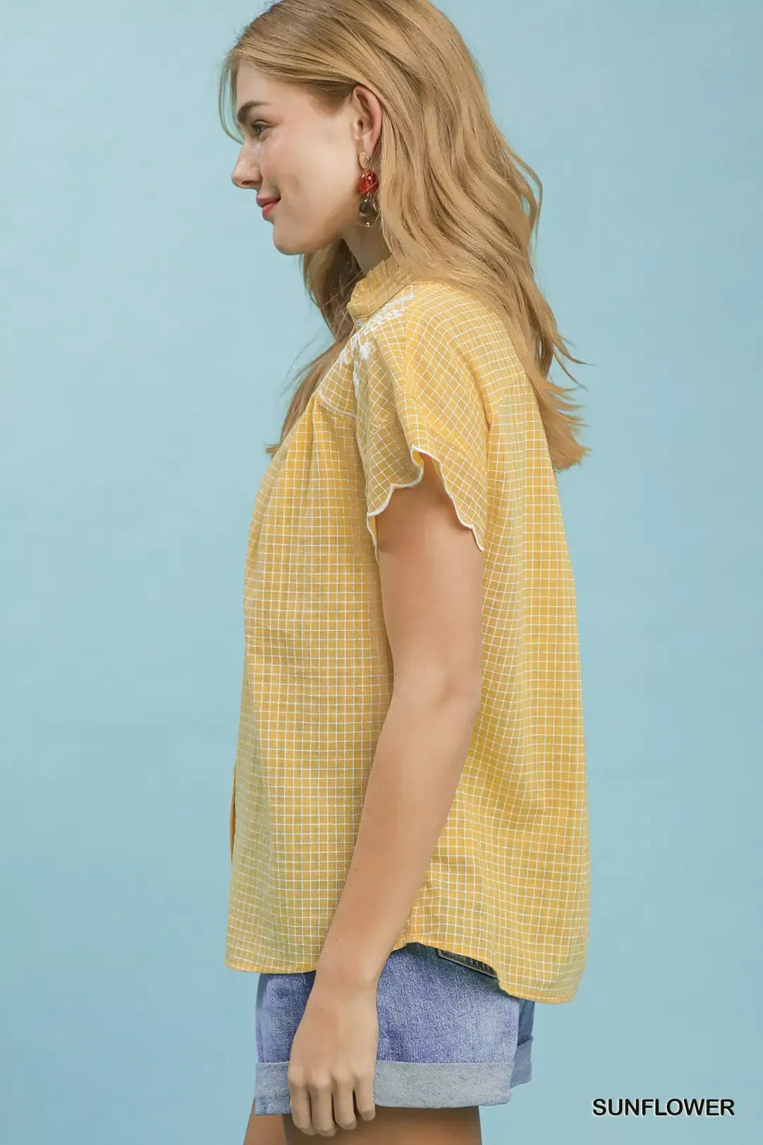 Sunflower embroidered plaid button-front blouse with scallop sleeves, side view