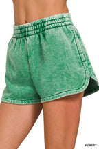 Acid-washed dolphin shorts with elastic waist, forest green back view