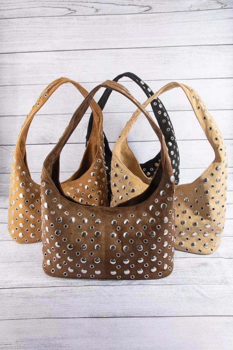 Studded shoulder bag set with brown, black, and tan designs and silver grommets