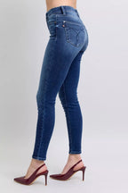 Washed dark blue skinny jeans, back patch pockets, stitched panel seams