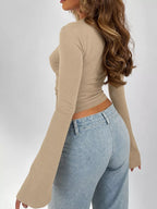 Khaki long sleeve tee, side view with fitted back and flared sleeve cuffs.
