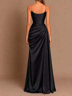 Black satin maxi dress with ruched back and draped flowing skirt