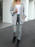 Chunky knit open cardigan with long lantern sleeves, light gray.