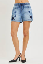 Denim shorts with elastic waist, drawstring front, star patches, medium wash