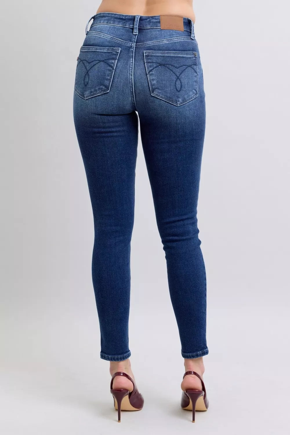 Washed dark blue skinny jeans, high-rise waistband, rear patch pockets