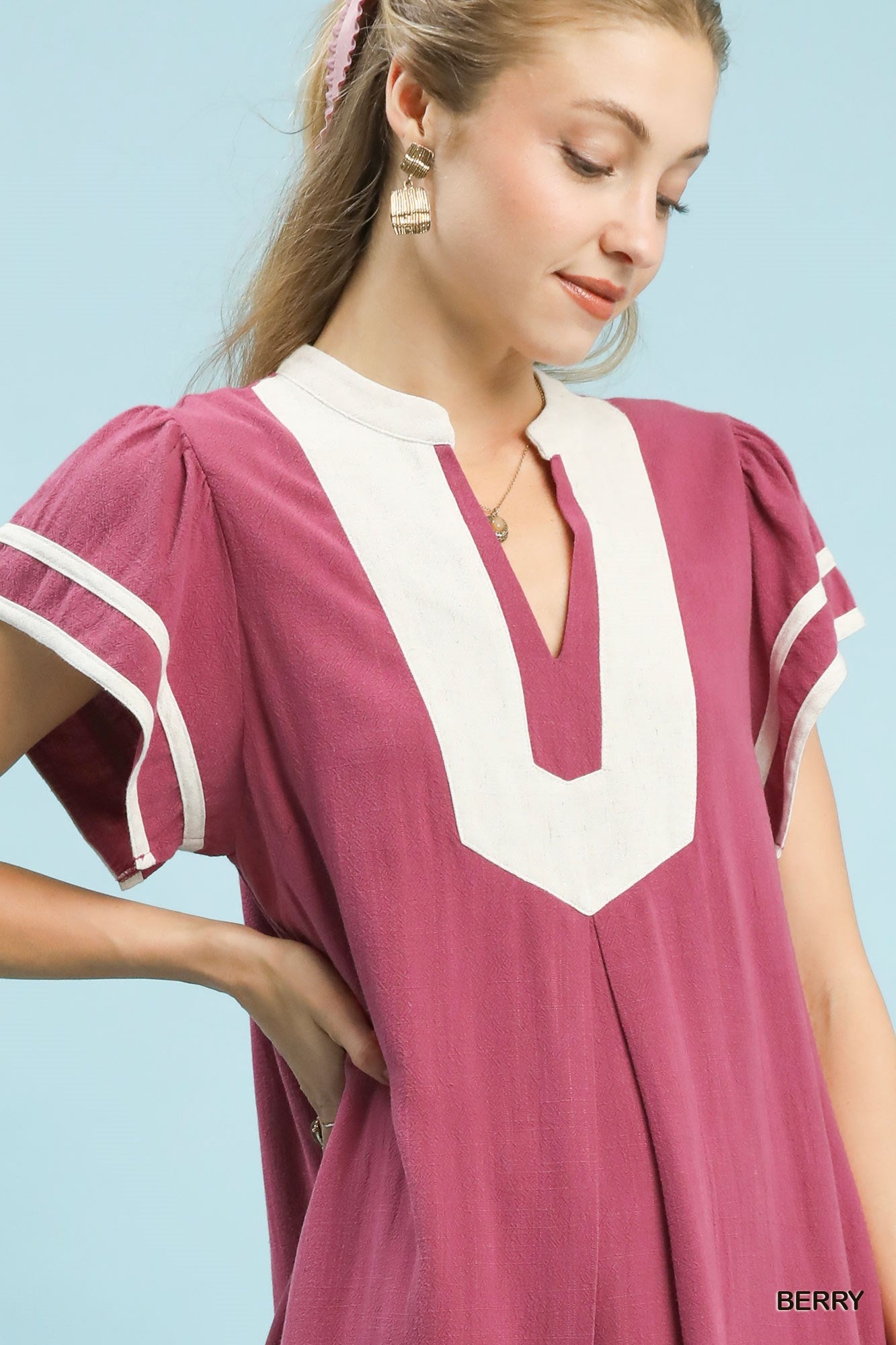 Berry linen V-neck short-sleeve dress with white contrast front panel and striped sleeves.
