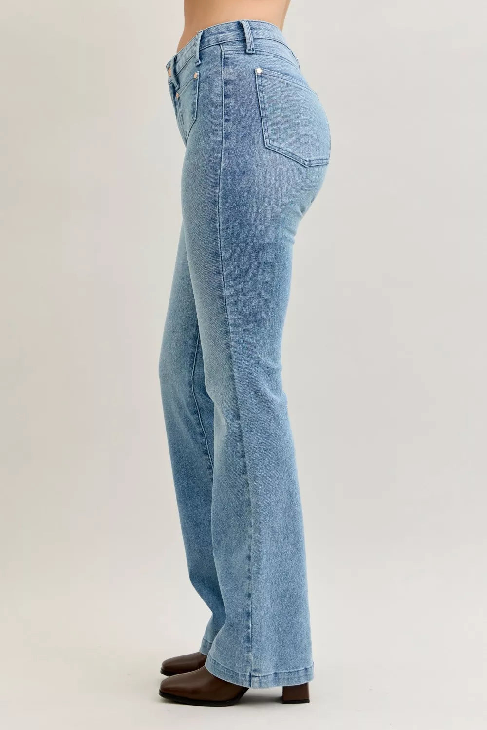 Light blue mid-rise bootcut jeans with rear pocket and back yoke seam