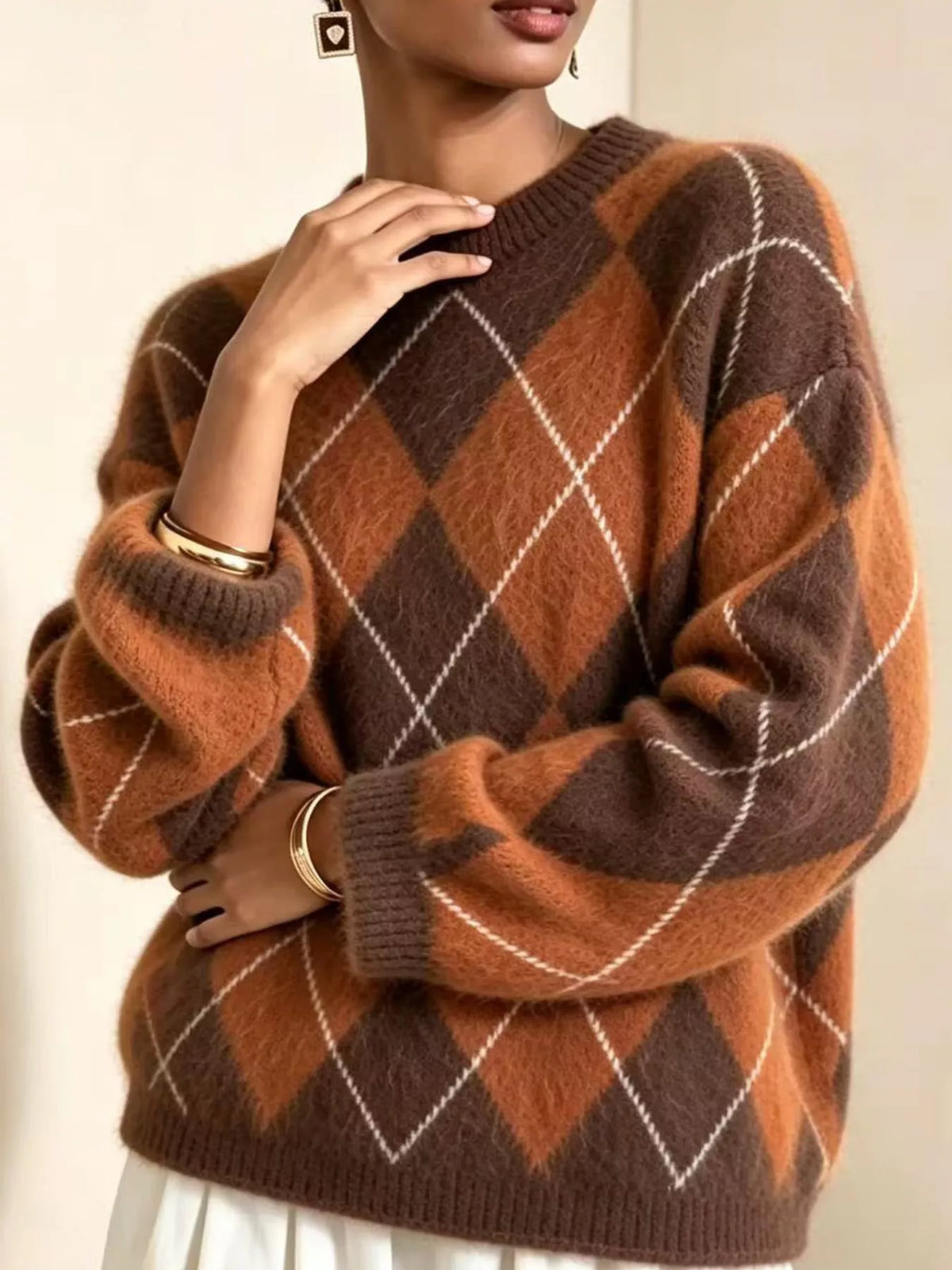 Fuzzy argyle knit sweater, brown with rust and white diamond pattern, crew neck.