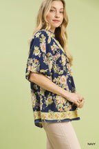 Navy floral boho rayon blouse with V-neck and short flutter sleeves, side view