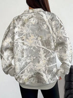 Oversized zip-neck sweatshirt, white-and-gray camouflage print, back view