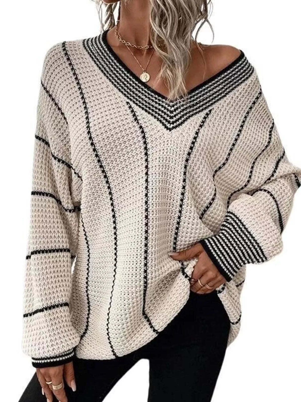 Light beige V-neck textured knit sweater with dark vertical stripes and ribbed cuffs