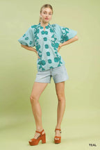 Women's teal floral cotton blouse with smocked yoke and wide puff sleeves