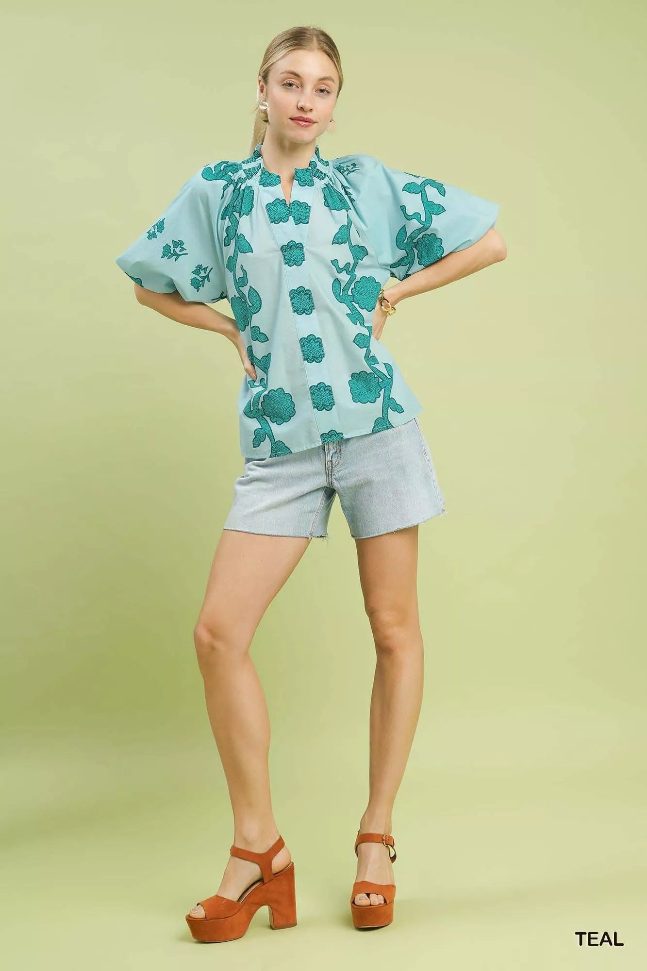 Women's teal floral cotton blouse with smocked yoke and wide puff sleeves