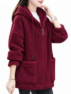 Burgundy fleece zip-up hoodie with drawstring hood, front zipper, and patch pockets.