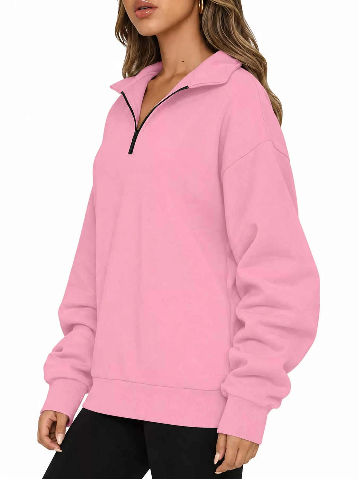 Pink oversized zip-neck sweatshirt with black-trim half-zip and relaxed cuffs