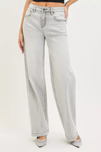 Light grey baggy jeans with front pockets and relaxed wide leg opening