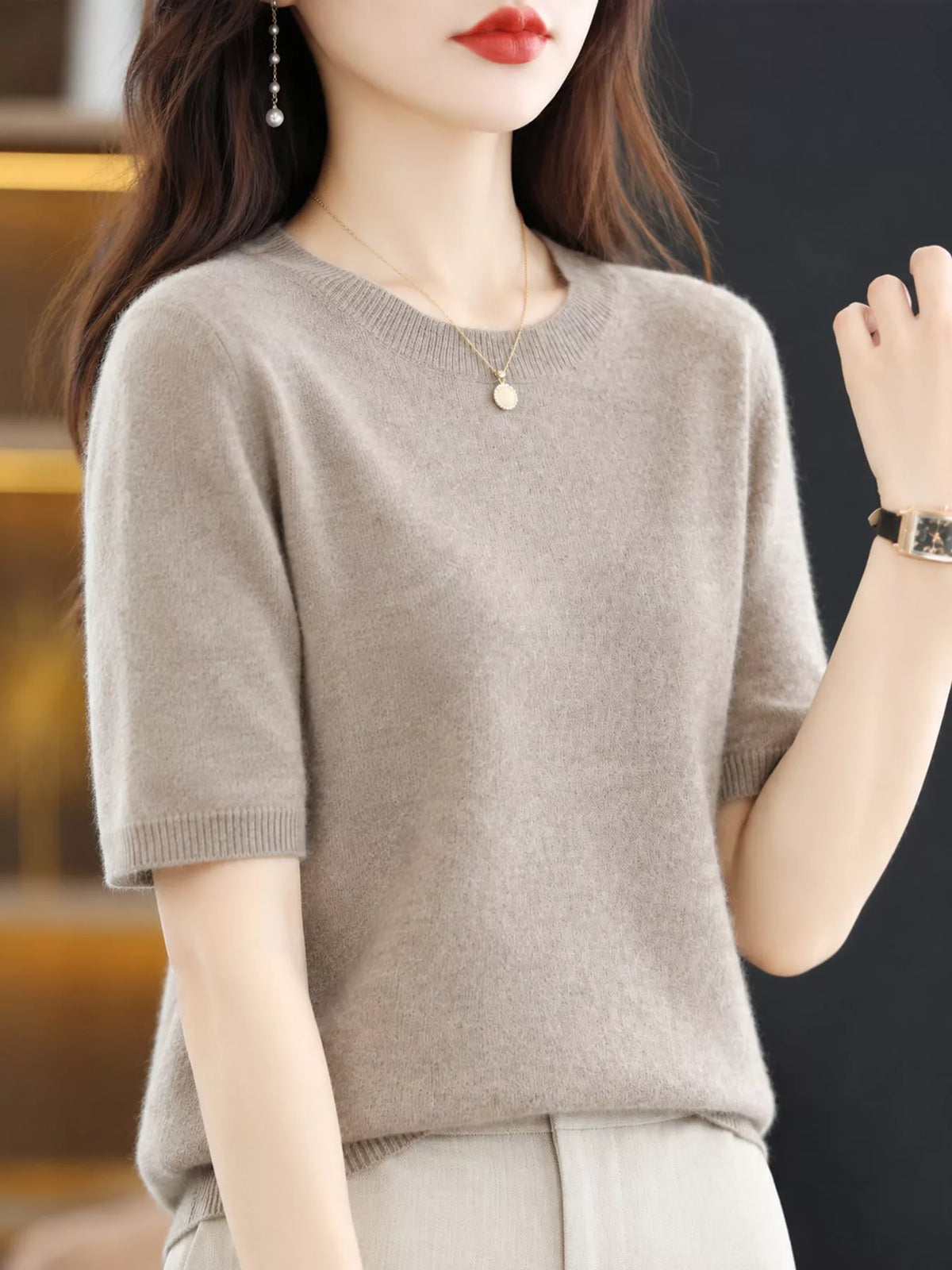 Taupe round-neck short-sleeve sweater with ribbed collar, cuffs, and hem