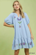 Light blue babydoll dress with embroidered floral V-neck and puff sleeves