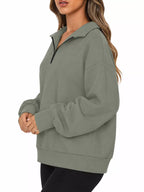Oversized zip-neck sweatshirt, olive-gray with half-zip collar and relaxed sleeves