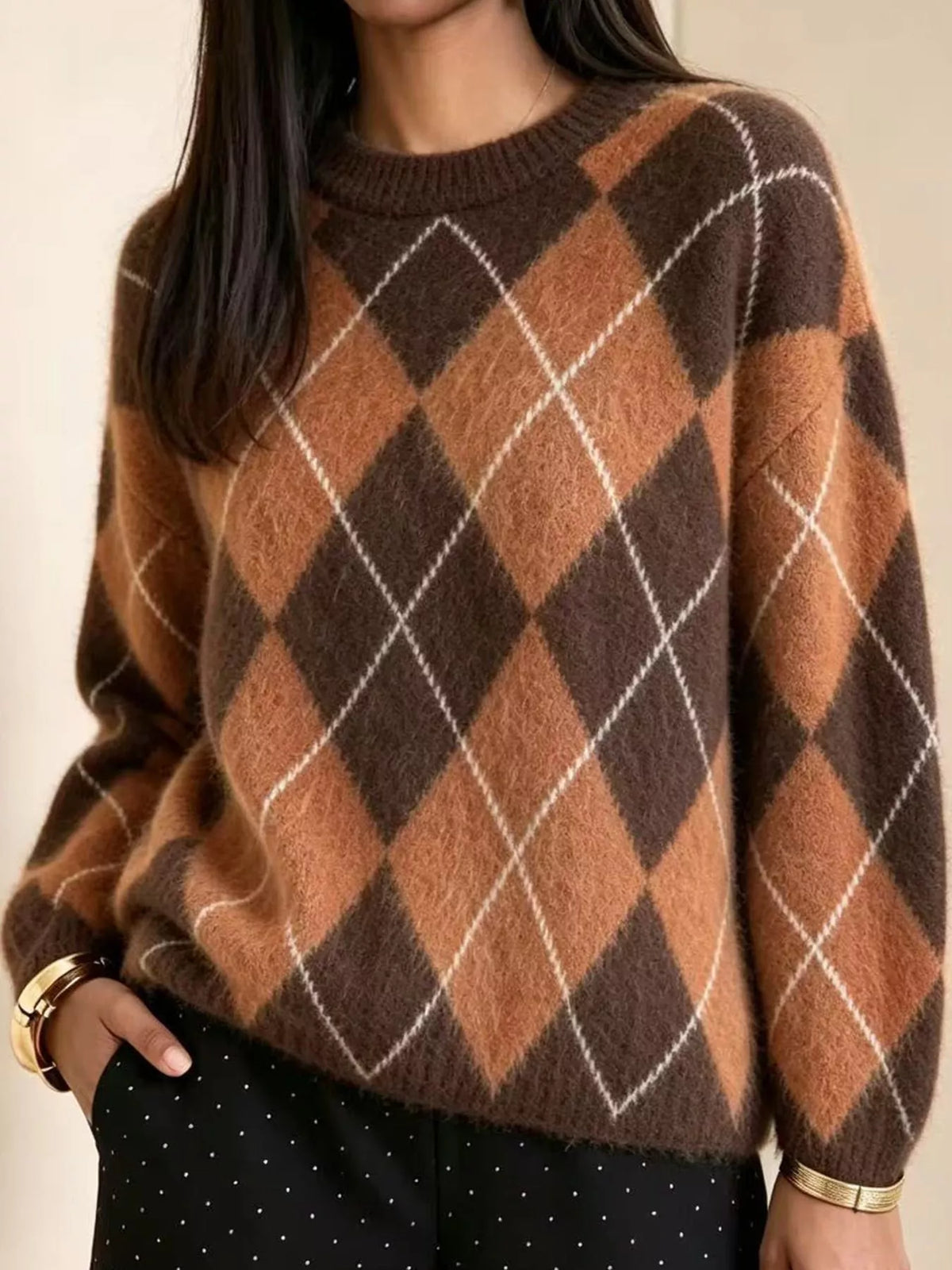 Fuzzy argyle knit sweater with brown, rust, and white diamond pattern; long sleeves.