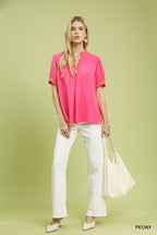 Embroidered linen puff-sleeve blouse in peony pink with V-neck embroidery