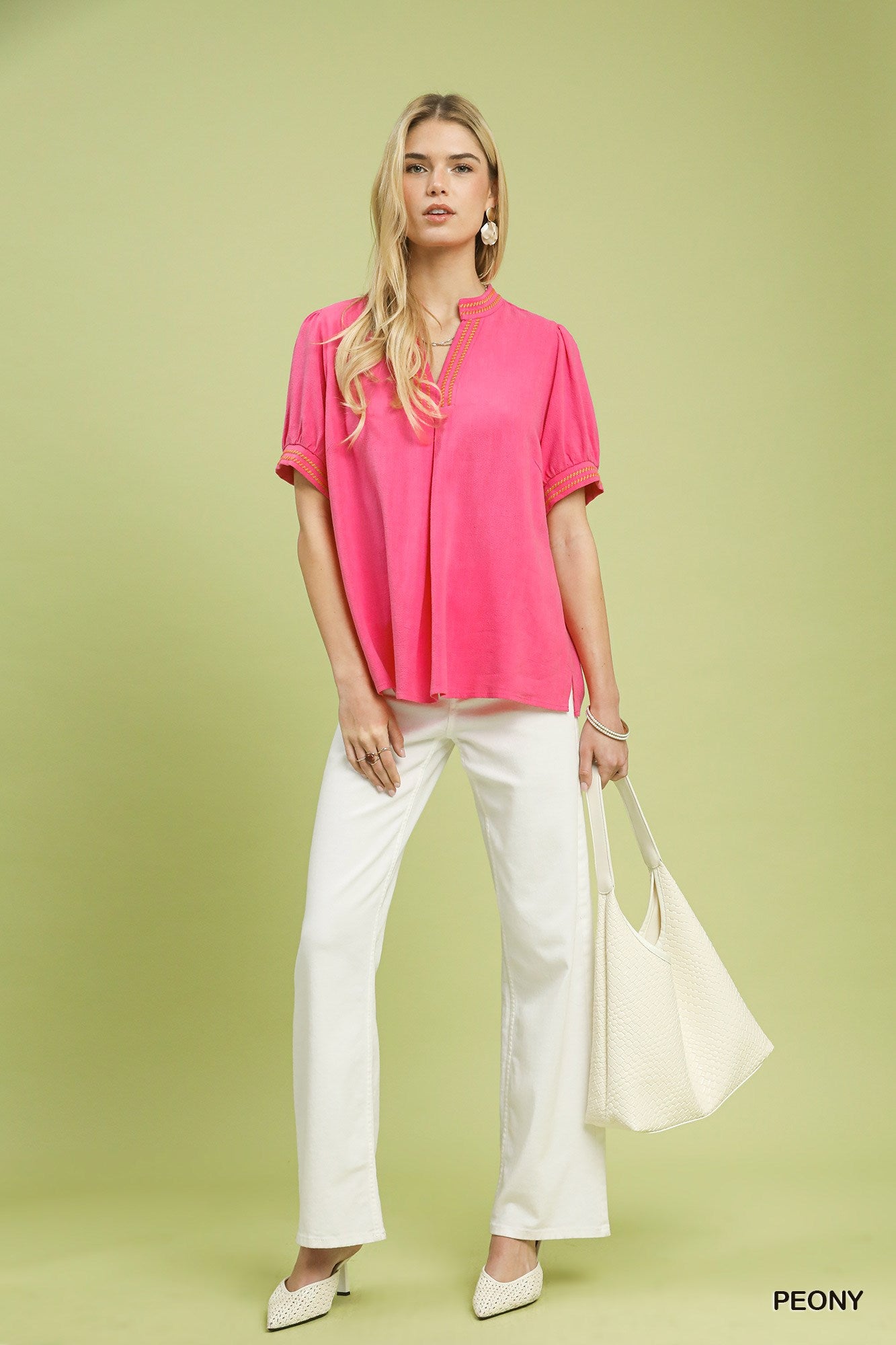 Embroidered linen puff-sleeve blouse in peony pink with V-neck embroidery