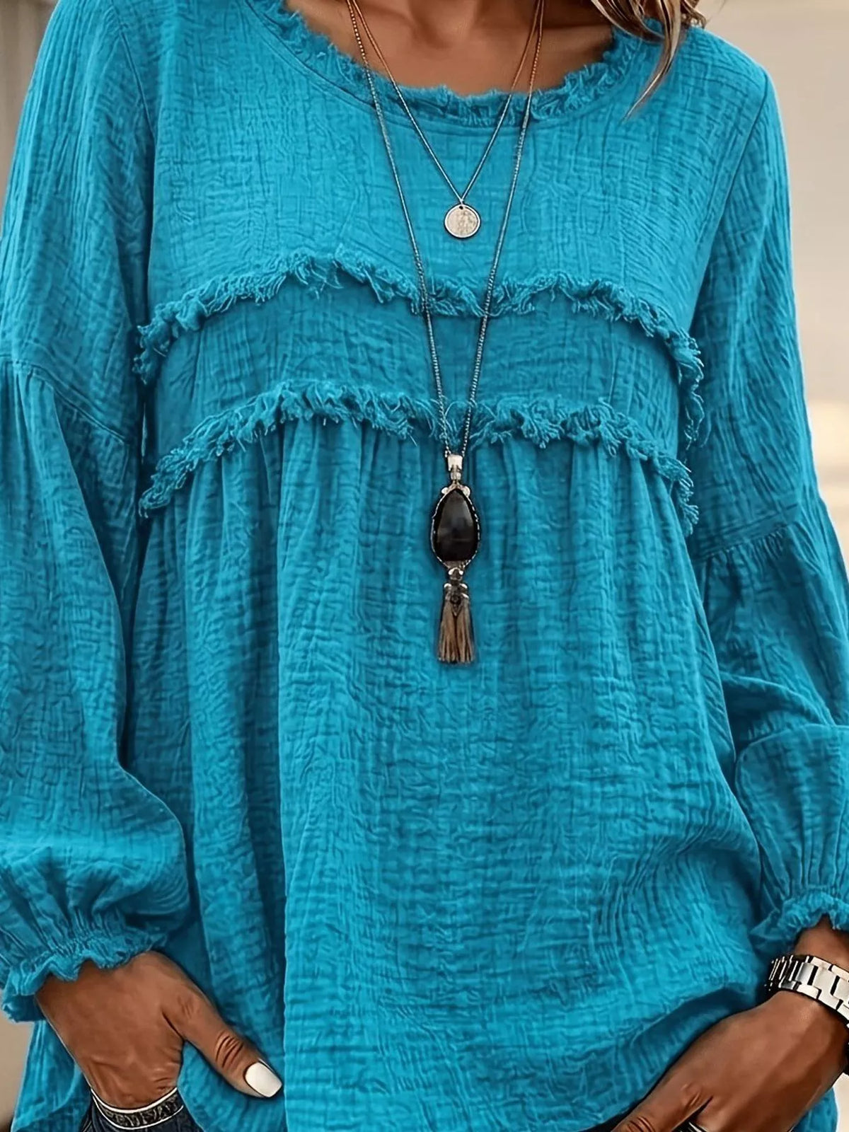 Teal peplum blouse with layered frayed yoke and long puff sleeves
