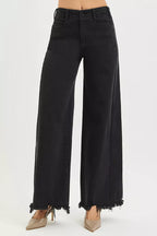 Black high-rise wide-leg jeans with frayed cuffs and button-front waistband