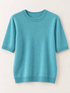 Teal round-neck short-sleeve knit sweater, ribbed collar, cuffs, and bottom hem