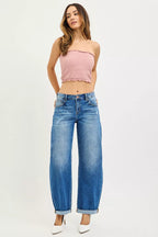 Dark wash mid-rise barrel jeans with cuffed hems and button front