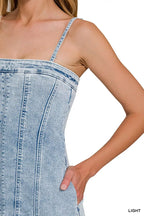 Light wash denim bodice with spaghetti straps and exposed vertical seam stitching