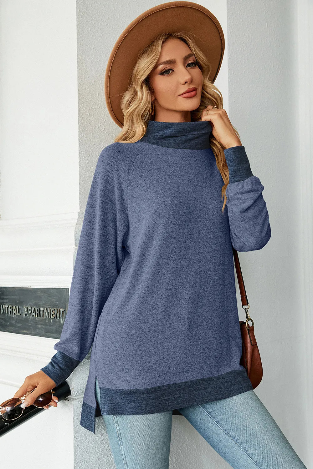 Light blue mock-neck long-sleeve slit tee with contrast hem band, front view
