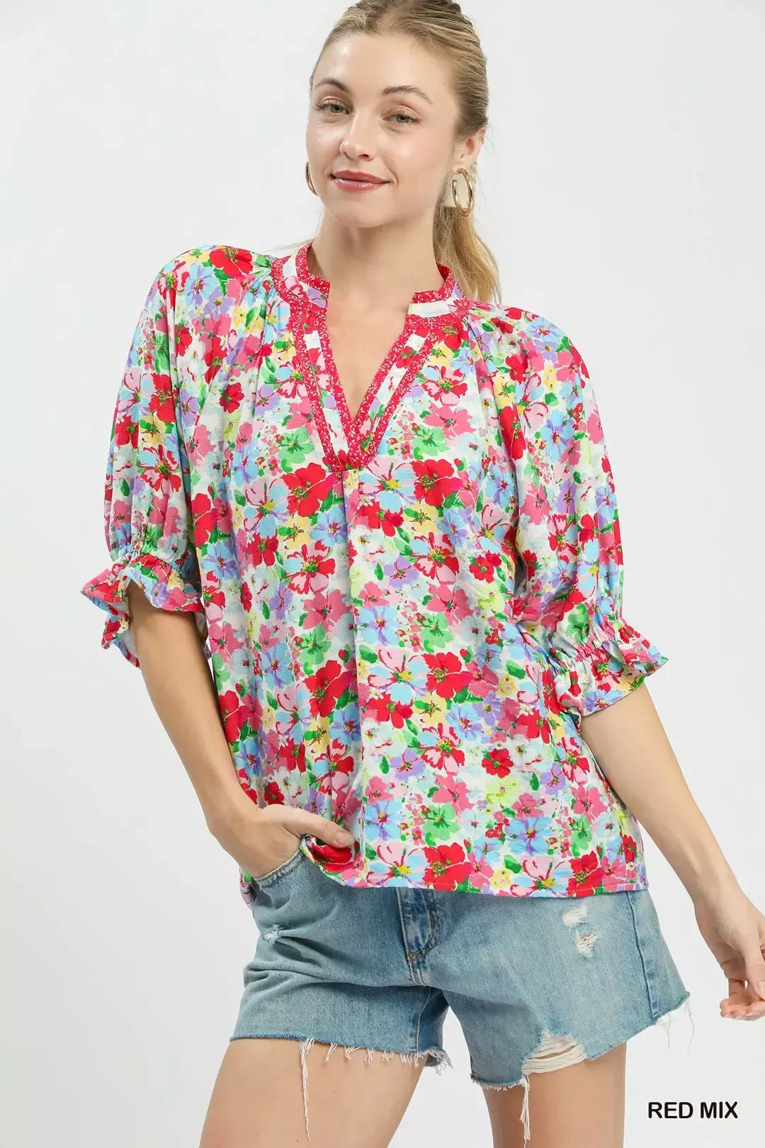 Red-and-blue mixed floral ruffle top, split V-neck with rolled cuffs