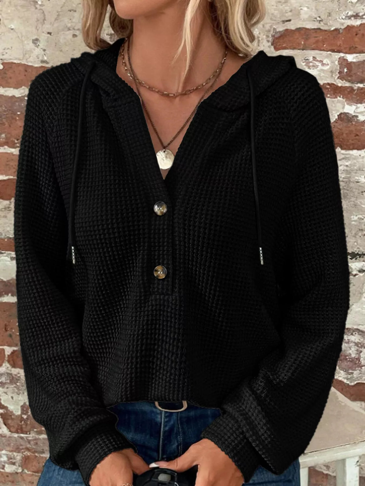 Black waffle-knit button hoodie with hood drawstrings and snap front placket