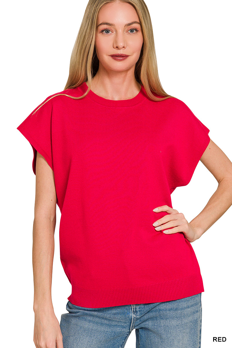 Red ribbed crewneck knit top with short sleeves, hand on hip