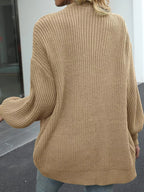 Chunky knit cardigan with lantern sleeves, open back view, beige-brown color.