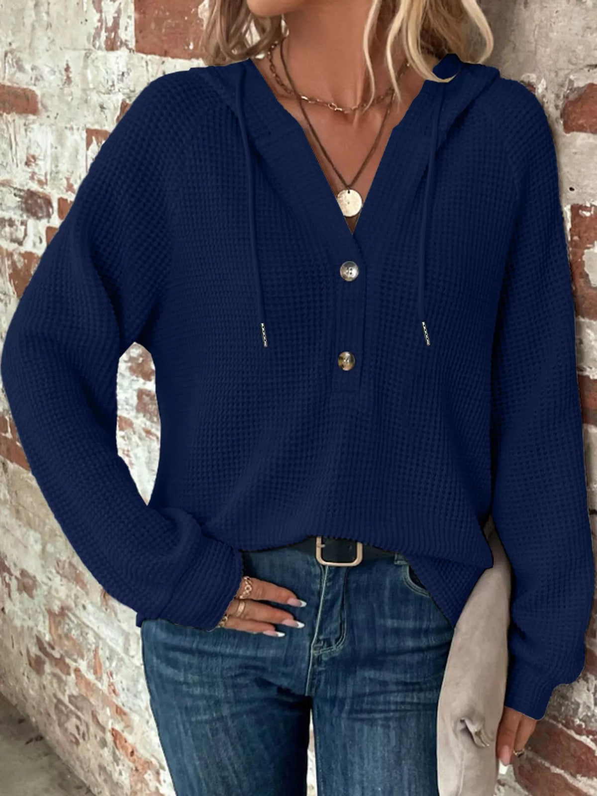 Navy waffle-knit button hoodie with hood, long sleeves, and front button closure.