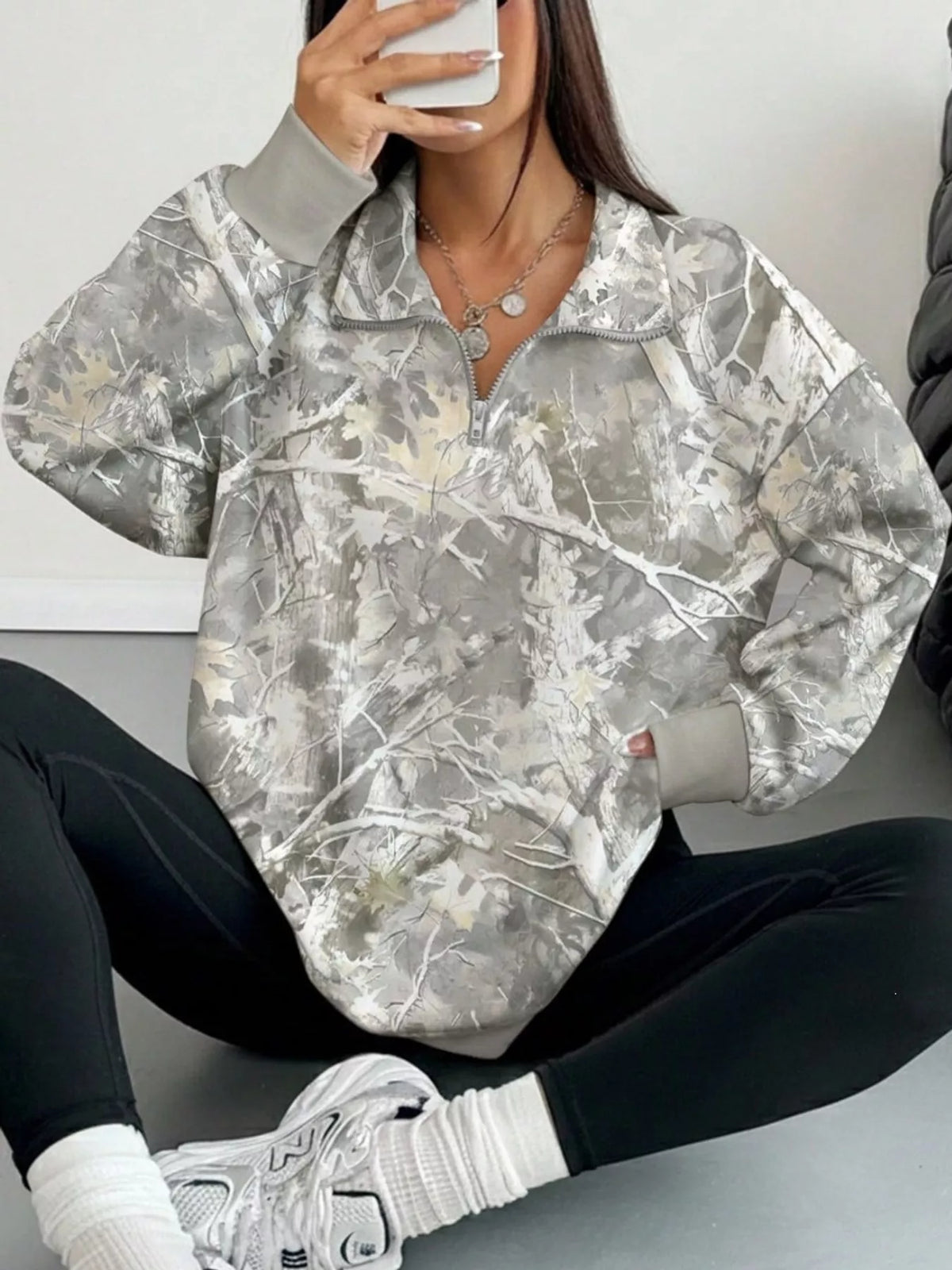 Light gray camo zip-neck oversized sweatshirt, half-zip collar and long sleeves